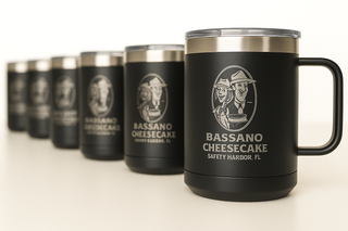 Row of branded coffee mugs with engraved business logos