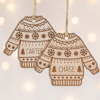 Two wooden Christmas sweater ornaments with names 'Carter' and 'Chase' on a soft background.